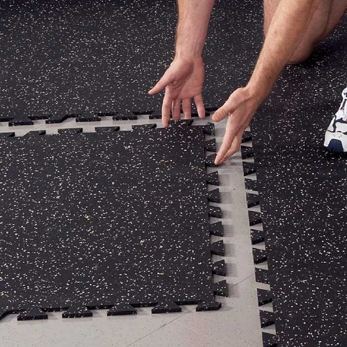 man install interlock rubber tiles
